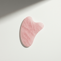 Rose Quartz Gua Sha — front view on model